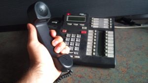 I have a desk phone. It's covered with dust.